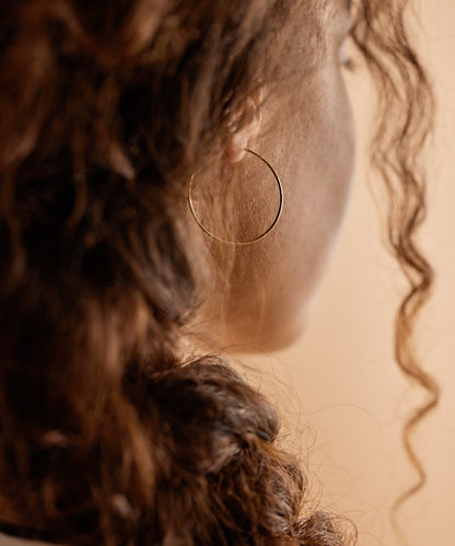 Model Wearing Pure Medical Grade Golden Titanium 30mm Ear Rings