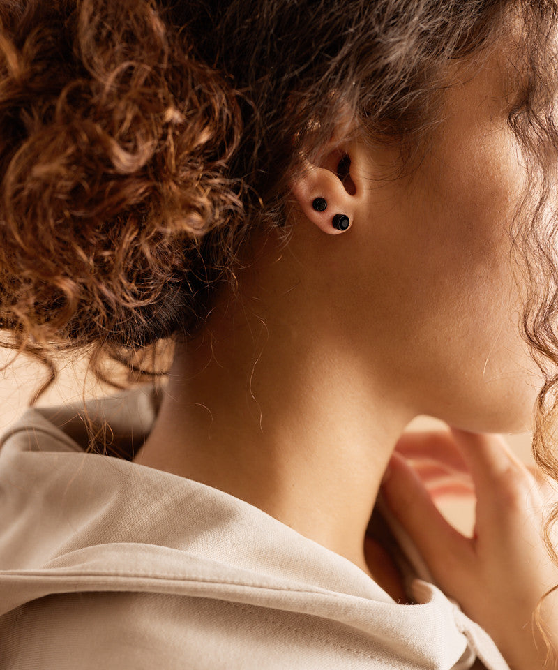 Model Wearing Pure Medical Grade Black Titanium 5mm and 6mm Black Crystal Bezel Earrings