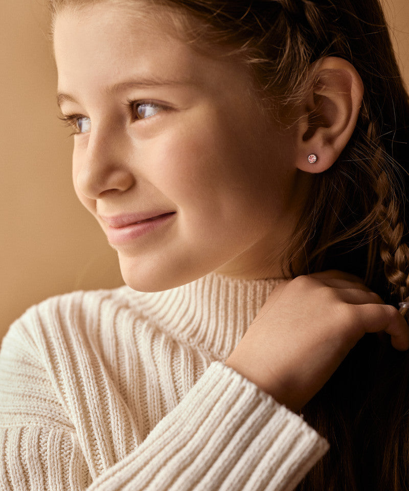 Model Wearing Hypoallergenic Silver Titanium 5mm Bezel Light Rose Earrings