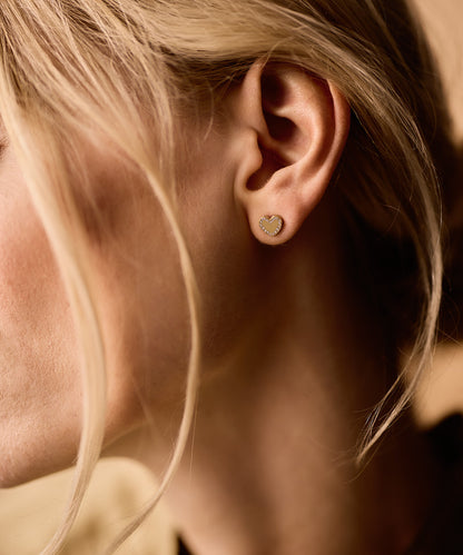 Golden titanium Brilliance Sweetheart earrings on model